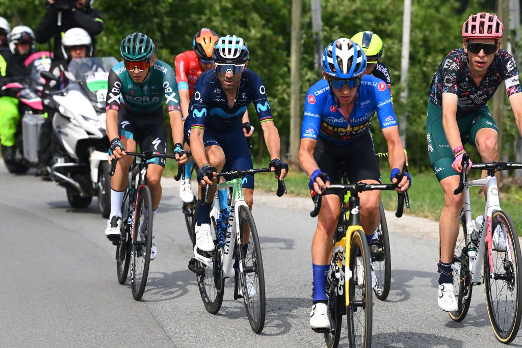 APRICA ITALY MAY 24 LR Lennard Kmna of Germany and Team Bora Hansgrohe Alejandro Valverde Belmonte of Spain and Movistar Team Koen Bouwman of Netherlands and Team Jumbo Visma Team Blue Mountain Jersey and Hugh Carthy of United Kingdom and Team EF Education Easypost compete in the breakaway during the 105th Giro dItalia 2022 Stage 16 a 202km stage from Sal to Aprica 1173m Giro WorldTour on May 24 2022 in Aprica Italy Photo by Tim de WaeleGetty Images