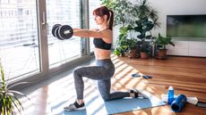 Woman builds strength at home with a set of best adjustable dumbbells