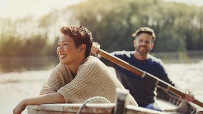 Couple rowing in a boat