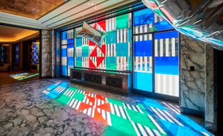 installation view of Daniel Buren's colourful glass squares