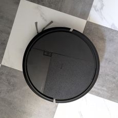 iRobot Roomba Plus 415 Combo cleaning black and white tiled floor