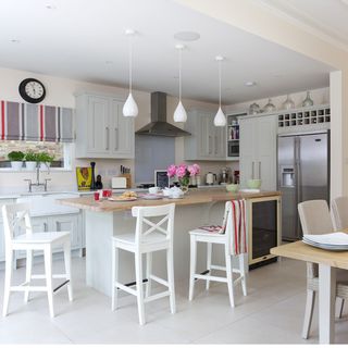 Kitchen with white walls and chairs