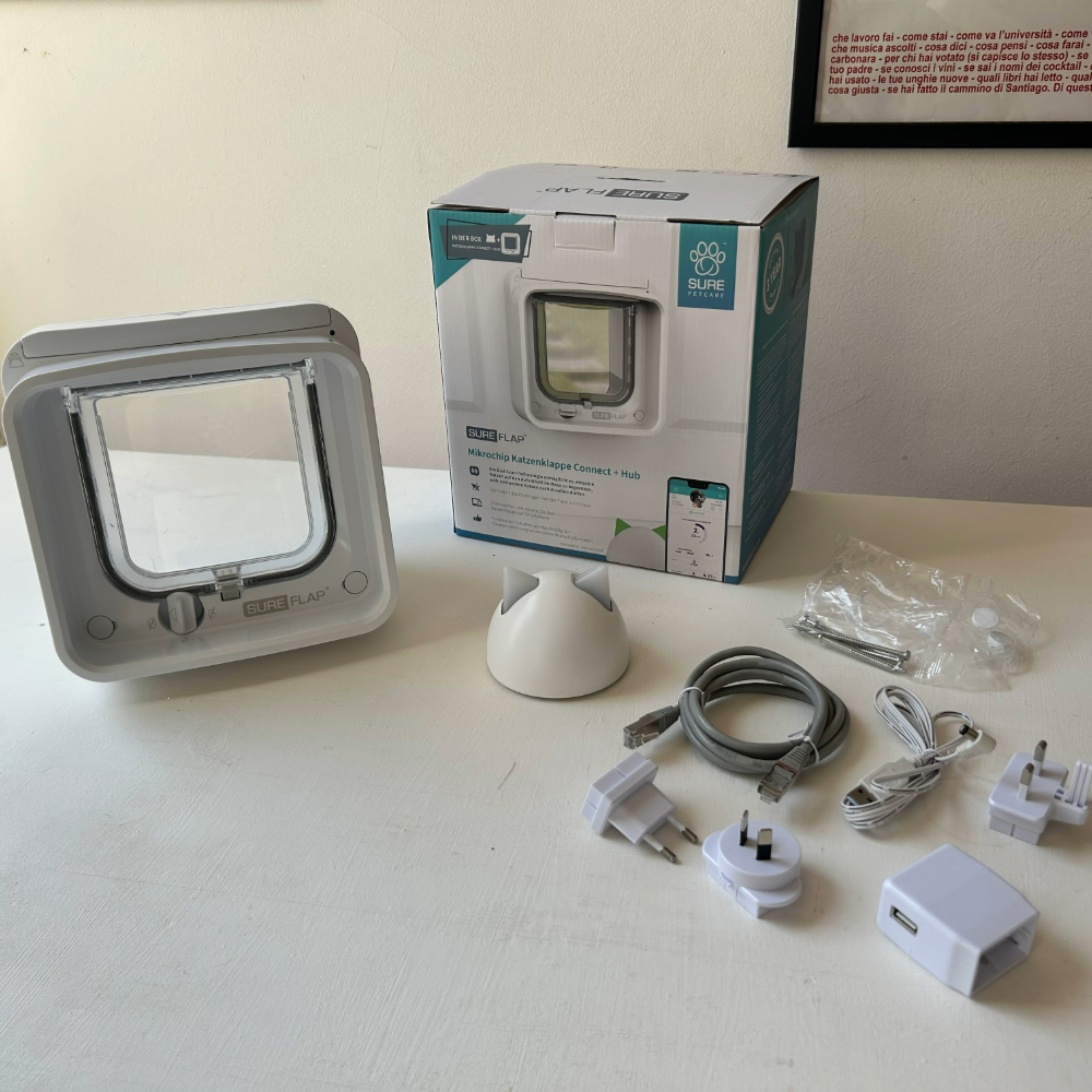 SureFlap Microchip Cat Door Connect with Hub Bundle, one of the best microchip cat flaps, with the box and accessories on Megan's table