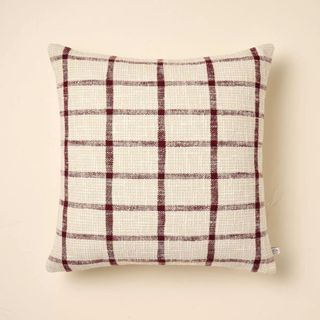 A maroon and white checkered pillow