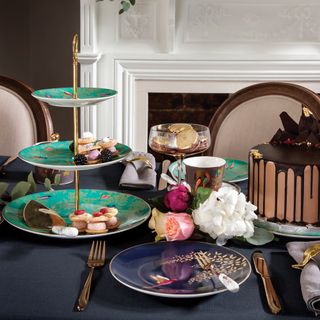 table with cake stand and plates