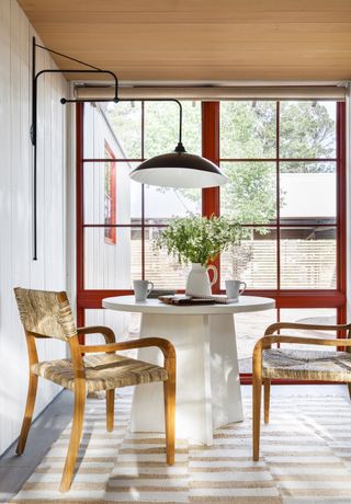 Dining nook with red windows