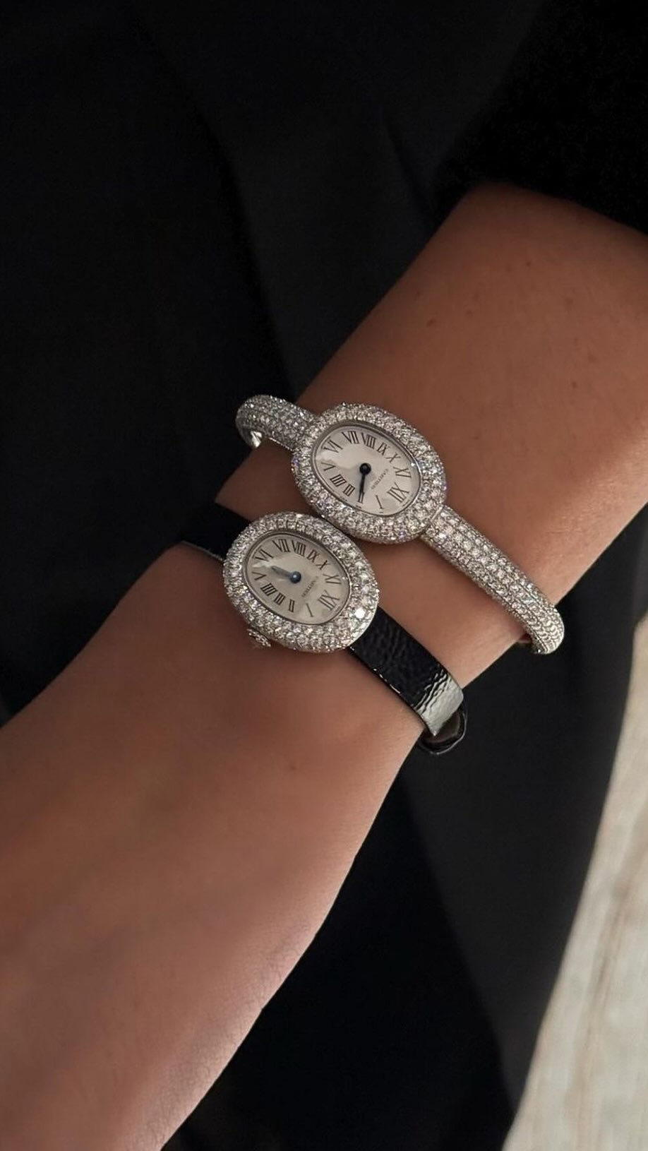 An close up image of @deborabrosa wearing a diamond encrusted Cartier Baignoire.