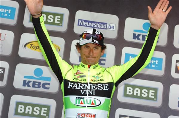 Filippo Pozzato salutes the crowd from the podium