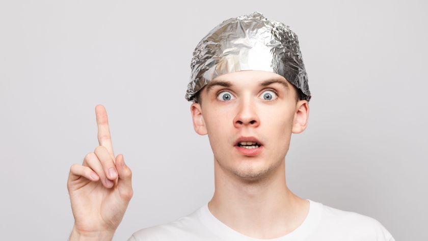 Man with tin foil hat on.