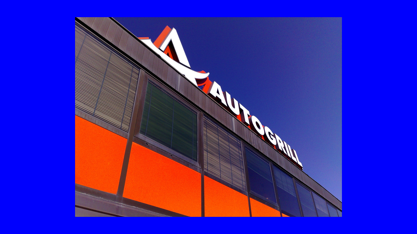 Autogrill bridge outlet on blue background