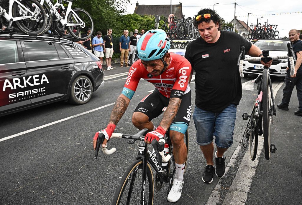 Lotto Soudal teams Australian rider Caleb Ewan reacts on his bicycle after suffering a crash during the 5th stage of the 109th edition of the Tour de France cycling race 1537 km between Lille and Arenberg Porte du Hainaut in northern France on July 6 2022 Photo by Marco BERTORELLO AFP Photo by MARCO BERTORELLOAFP via Getty Images