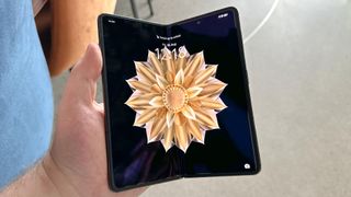 Honor Magic V2 partly open, in hand