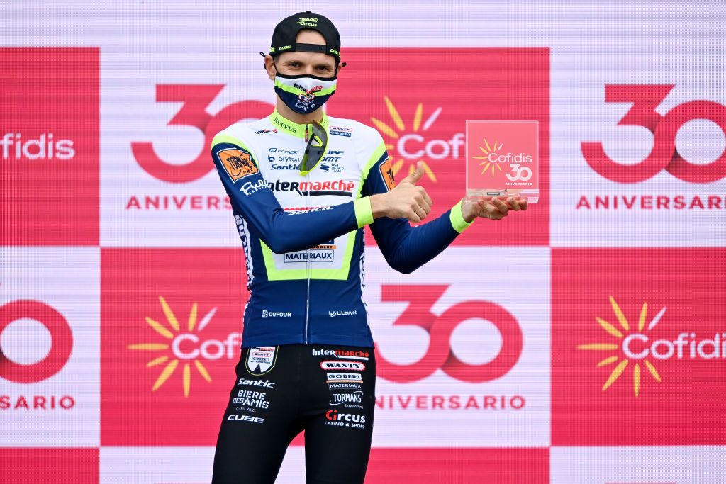 ESPINOSA DE LOS MONTEROS SPAIN AUGUST 16 Rein Taarame of Estonia and Team Intermarch Wanty Gobert Matriaux celebrates winning the stage on the podium ceremony after the 76th Tour of Spain 2021 Stage 3 a 2028km stage from Santo Domingo de Silos to Espinosa de los Monteros Picn Blanco 1485m lavuelta LaVuelta21 CapitalMundialdelCiclismo on August 16 2021 in Espinosa de los Monteros Spain Photo by Stuart FranklinGetty Images