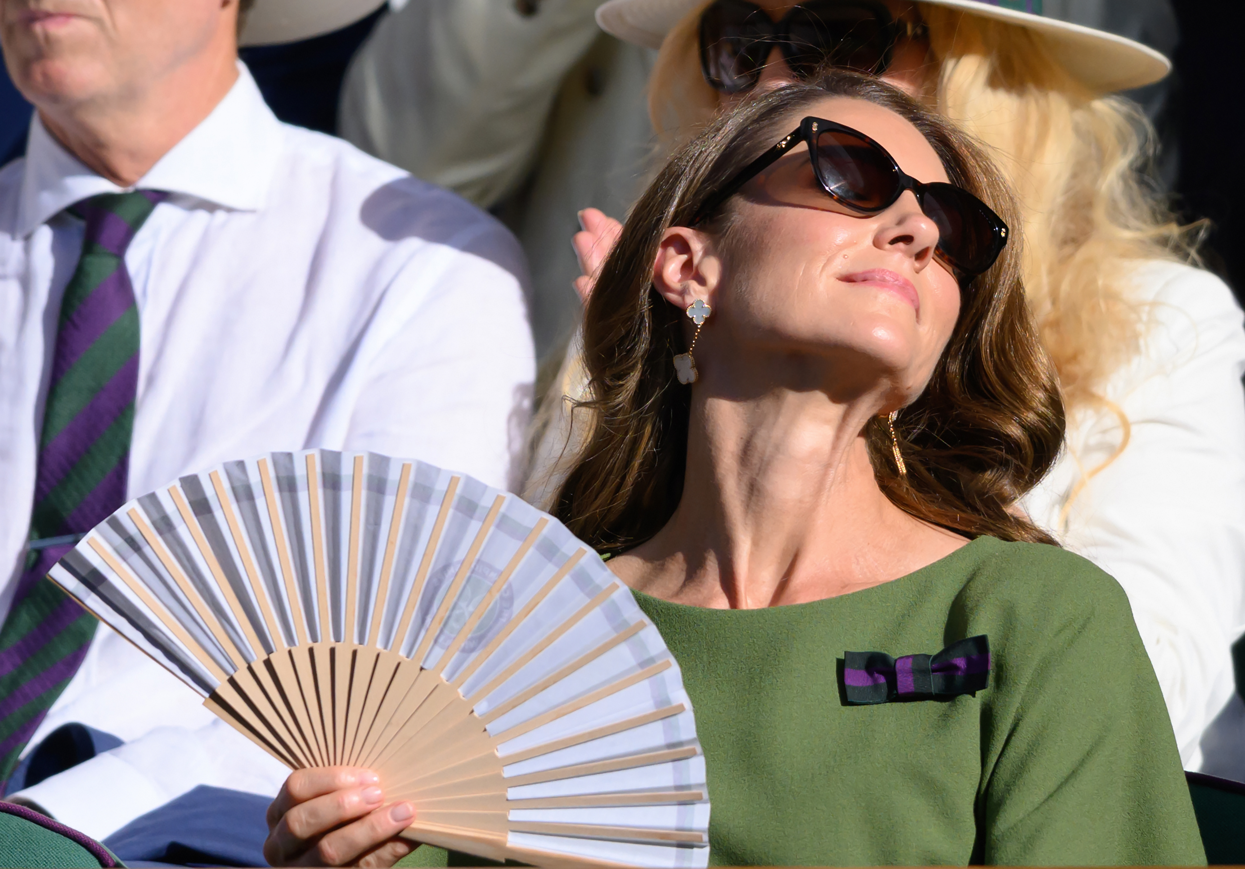 Princess Kate fanning herself at Wimbledon with a paper fan
