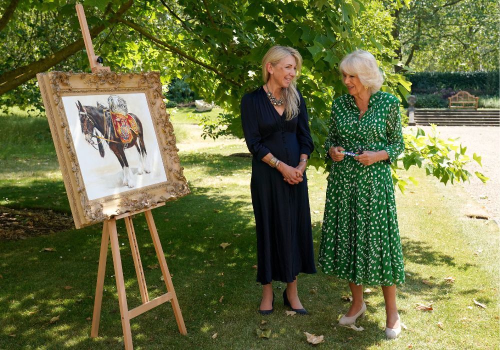 Queen Camilla wears a printed shirt dress