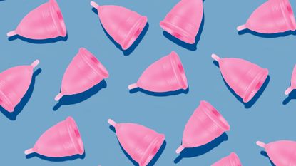 pink menstrual cups on blue background