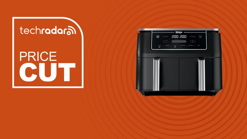 The Ninja Foodi Dual Zone Air Fryer on an orange background with text saying price Cut.