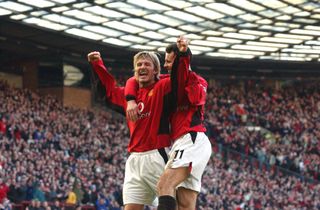 David Beckham celebrates with Ryan Giggs after scoring a free-kick for Manchester United against Portsmouth in the FA Cup in January 2003.