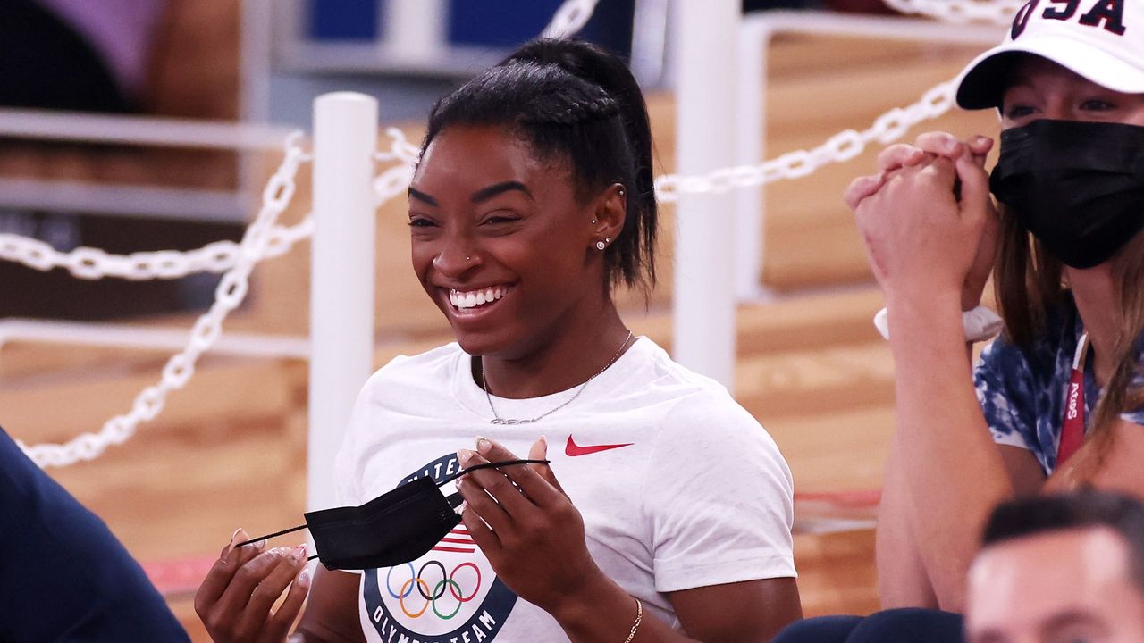 tokyo, japan august 01 simone biles of team united states cheers with teammates jordan chiles l and grace mccallum r from the stands during the womens vault final on day nine of the tokyo 2020 olympic games at ariake gymnastics centre on august 01, 2021 in tokyo, japan photo by jamie squiregetty images