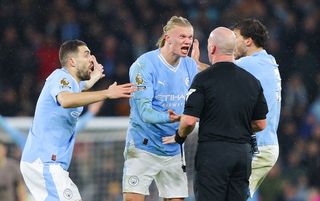 Erling Haaland angrily confronts referee Simon Hooper