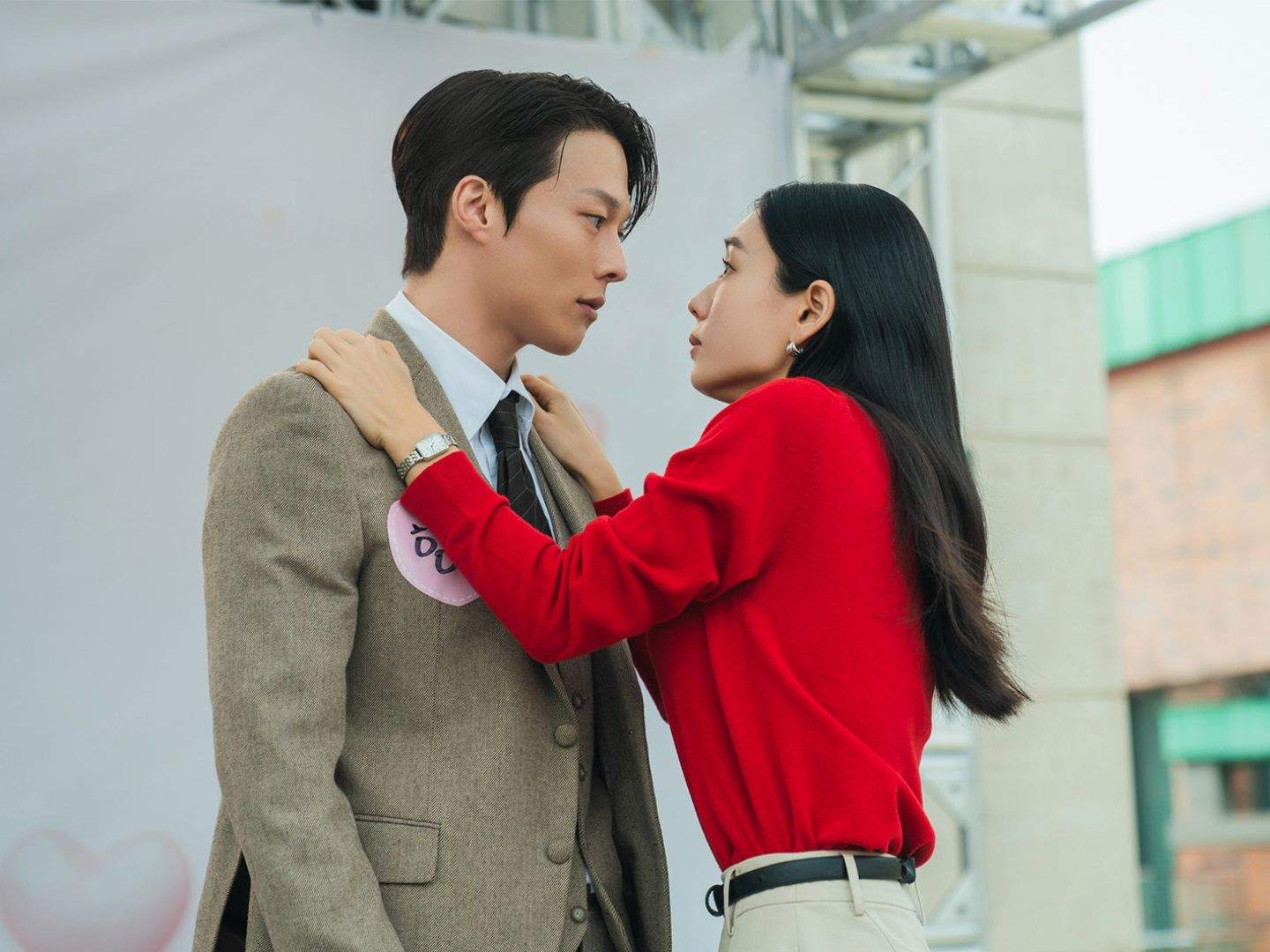 A woman (Ahn Eun-jin, right) stands with her hands on a man&#039;s (Kang Ji-yong, left) shoulders, in the K-drama &#039;Dynamite Kiss.&#039;
