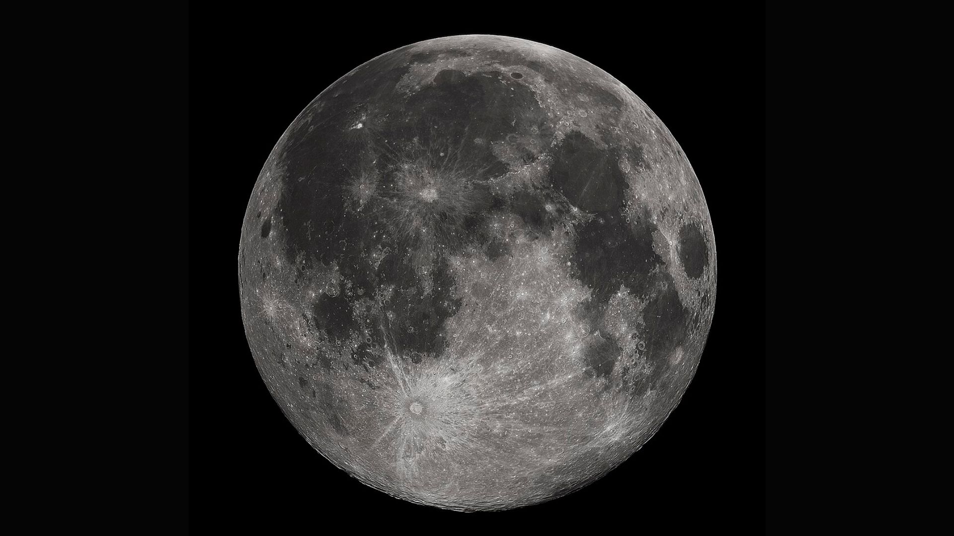 A close up of the moon in the darkness of space, showing its southern pole