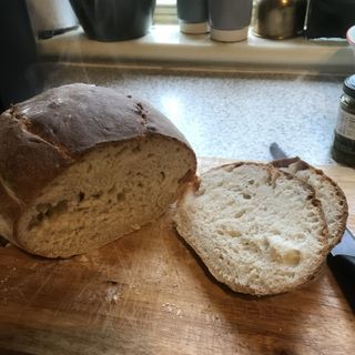 sourdough bread cut open and placed on a chopping board, cooked in multi cooker