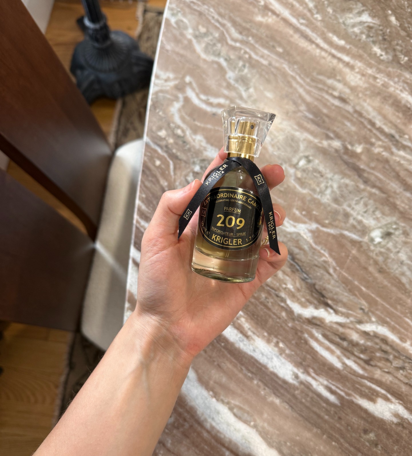 Photo of Jamie Schneider testing Krigler's EXTRAORDINAIRE CAMELIA 209 perfume