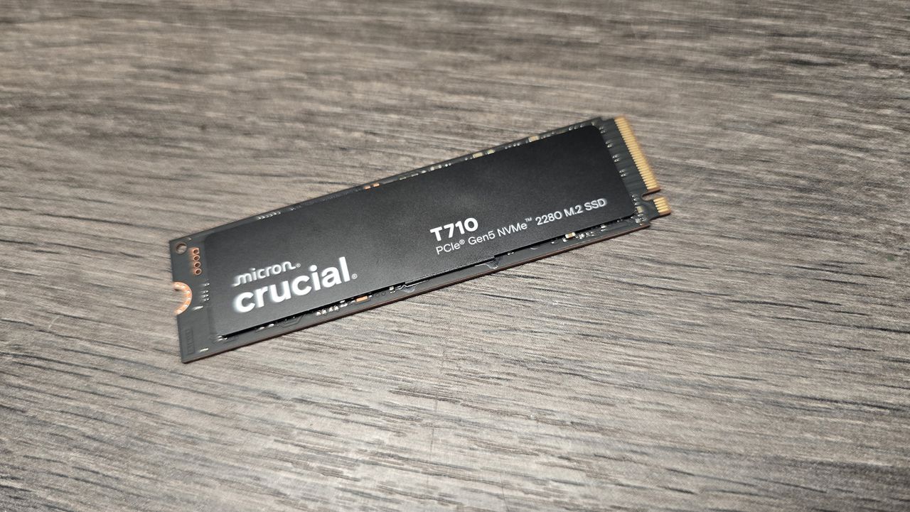 A Crucial T710 SSD on some fans ready to be installed inside a gaming PC.