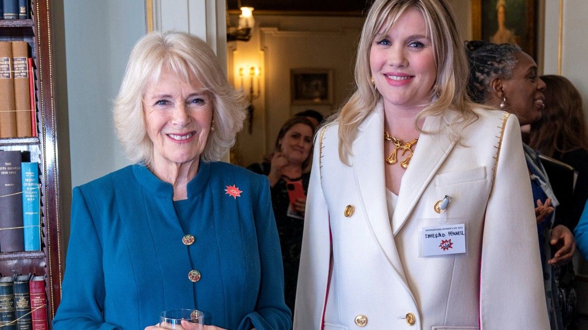 Britain&#039;s Camilla, Duchess of Cornwall and President of Women of the World Festival (L), meets actor Emerald Fennell, who portrayed the Duchess in the television series &#039;The Crown&#039;, during a reception to mark International Women&#039;s Day at Clarence House, in London, on March 8, 2022