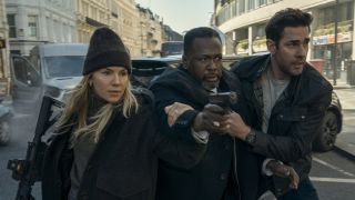 Emma Marlow (Sienna Miller), Jim Greer (Wendell Pierce) and Jack Ryan (John Krasinski) try to get to safety in Jack Ryan: Ghost War.
