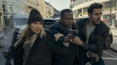 Emma Marlow (Sienna Miller), Jim Greer (Wendell Pierce) and Jack Ryan (John Krasinski) try to get to safety in Jack Ryan: Ghost War.