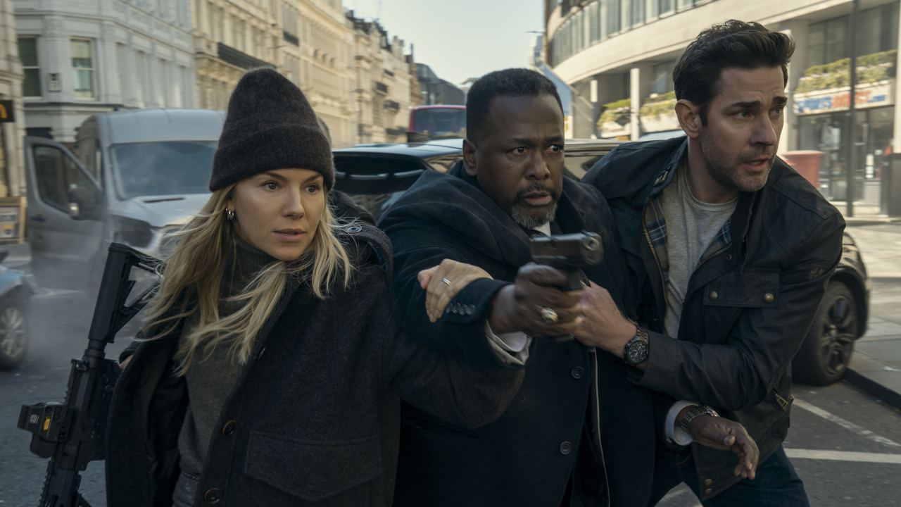 Emma Marlow (Sienna Miller), Jim Greer (Wendell Pierce) and Jack Ryan (John Krasinski) try to get to safety in Jack Ryan: Ghost War.