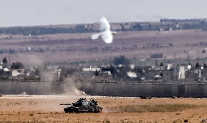 A Turkish tank coming from clashes with ISIS