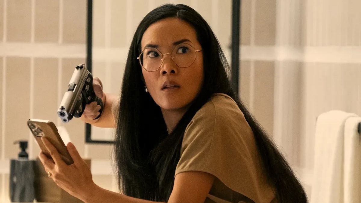 Ali Wong in Beef, holding gun to phone