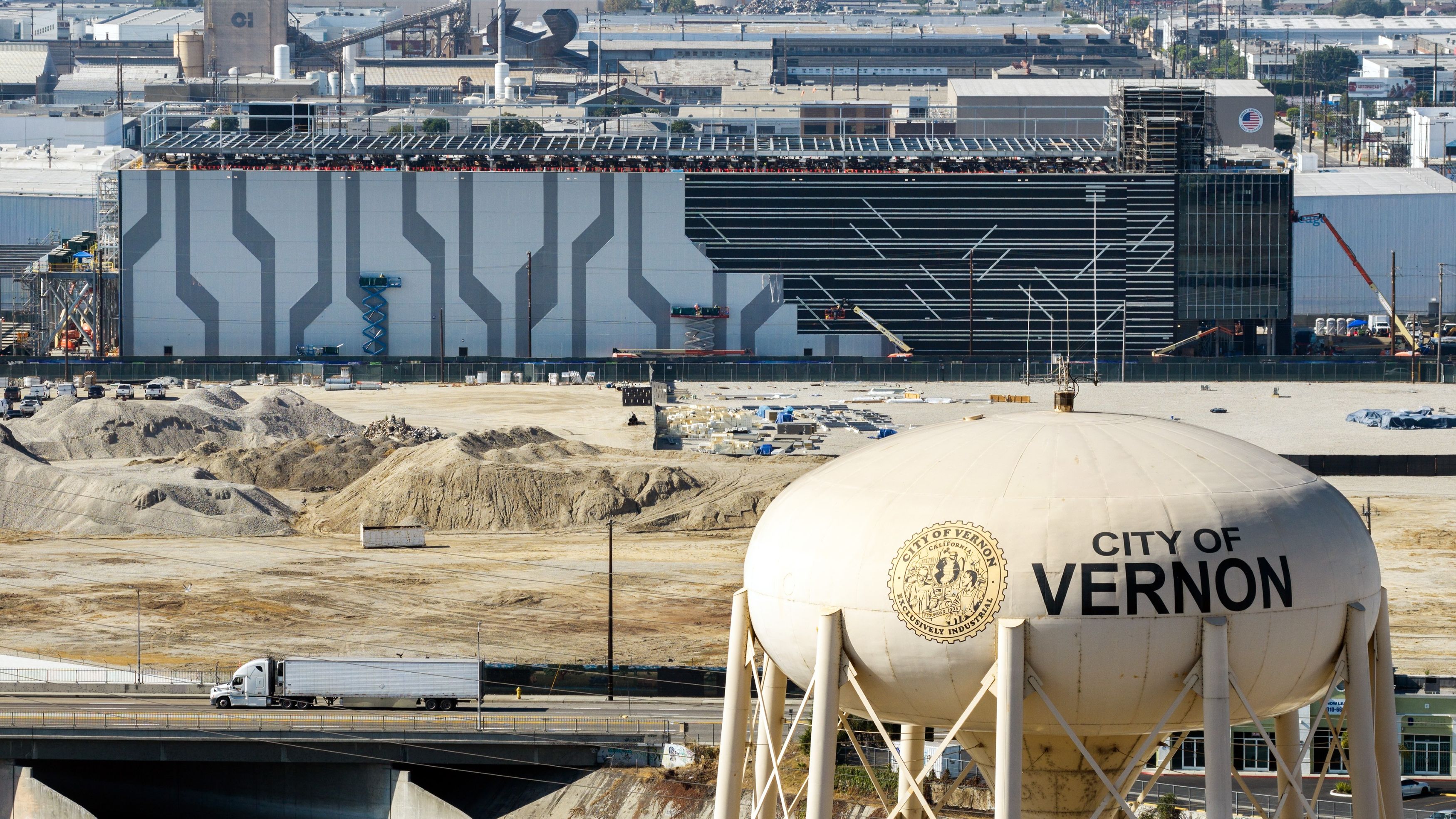 a data center being built behind a water tower