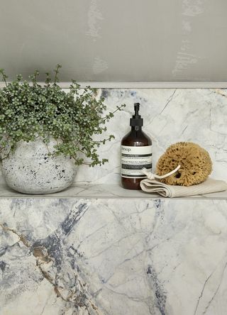 How to design a bathroom in an awkward space with large-format tiles in deep veining