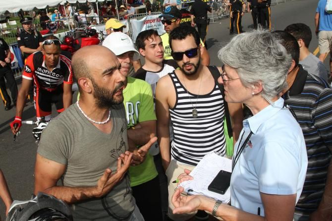 The team's owner pleads his case with the race official-to no avail. The finish being over turned as a final result.