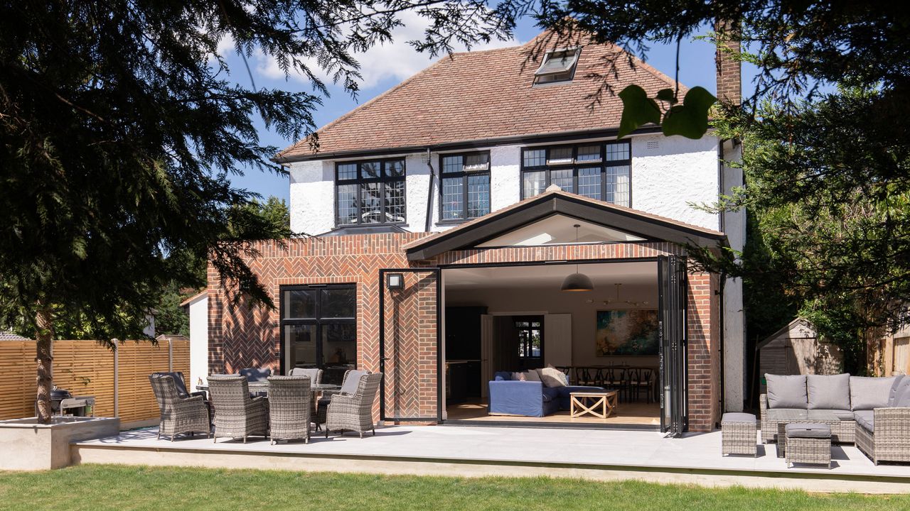 demolishing an old conservatory exterior view of a newly renovated property with bifold doors 