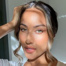 @misstpw taking a selfie with glowing skin