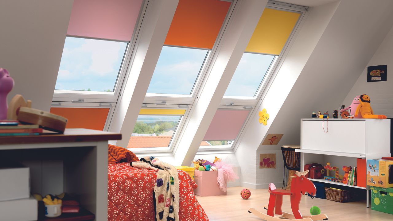 Colourful loft and child&#039;s bedroom with blinds at windows by Hillarys