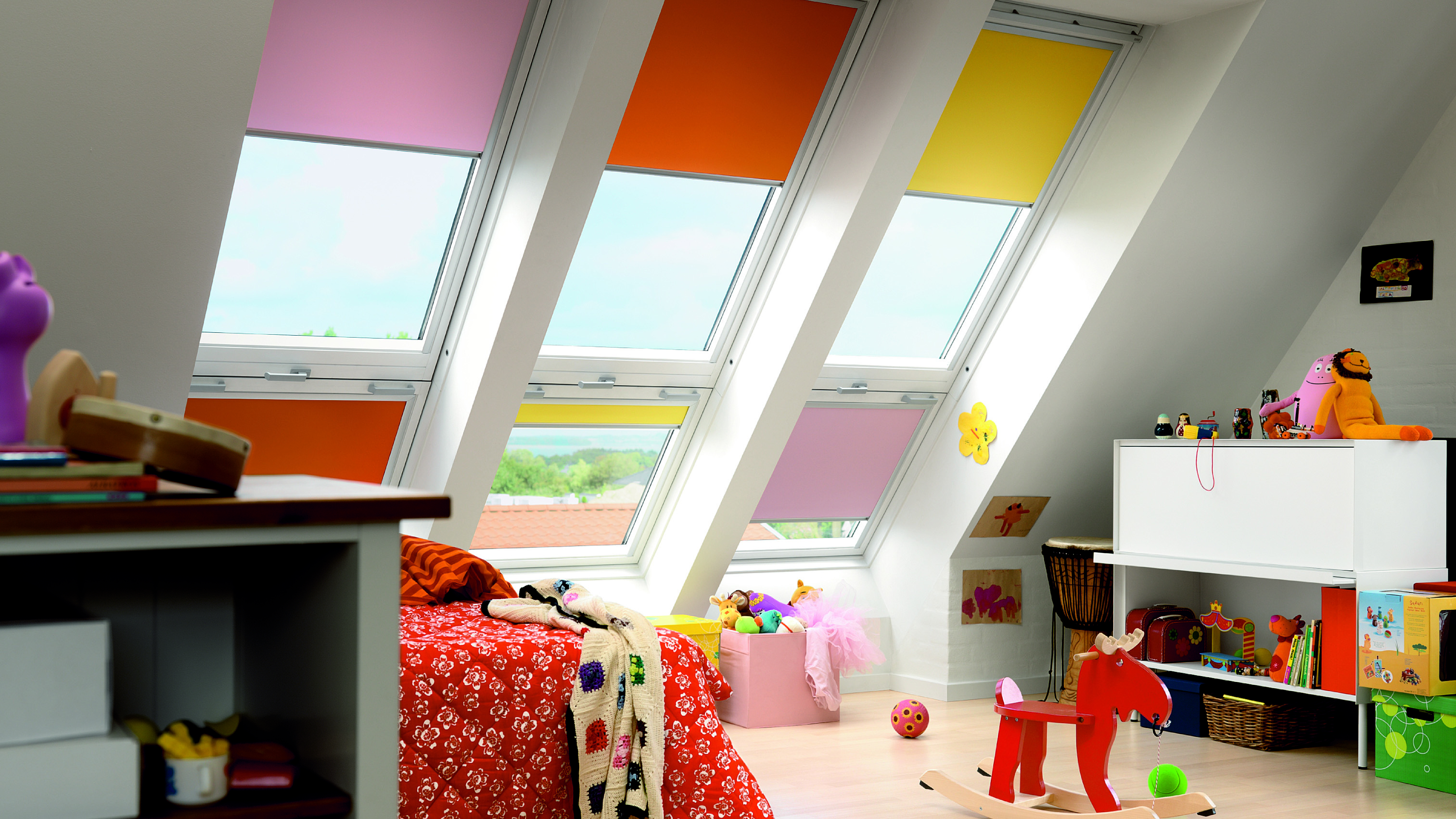 Colourful loft and child's bedroom with blinds at windows by Hillarys