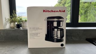KitchenAid coffee machine box on grey countertops