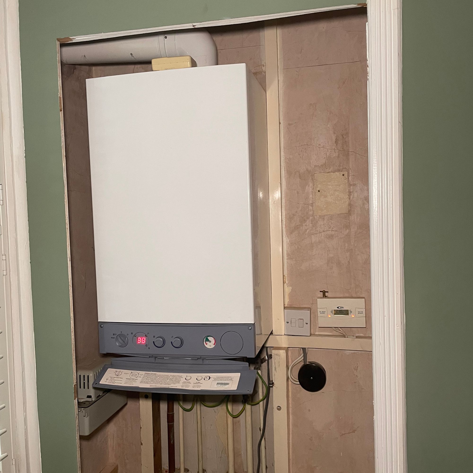 Old boiler in a boiler cupboard