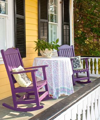 purple rocking chairs on porch