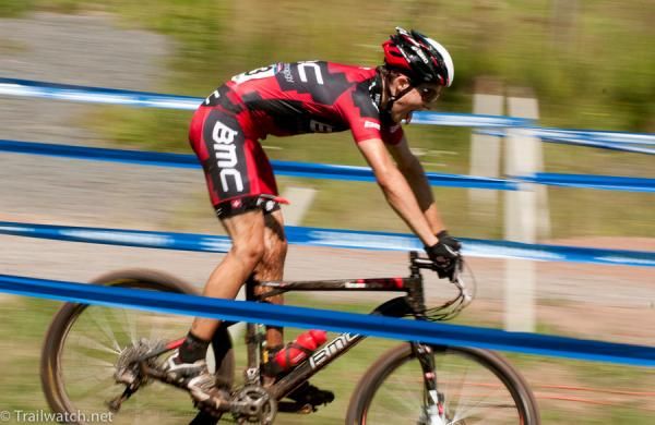 A BMC racer flying down a fire road descent