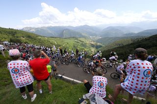 CAUTERETSCAMBASQUE FRANCE JULY 06 A general view of the peloton climbing to the Col dAspin 1490m while fans cheer during the stage six of the 110th Tour de France 2023 a 1449km stage from Tarbes to CauteretsCambasque 1355m UCIWT on July 06 2023 in CauteretsCambasque France Photo by Tim de WaeleGetty Images