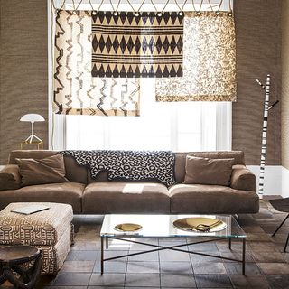 living room with brown sofa set brown wall with curtains and brown tiles on flooring