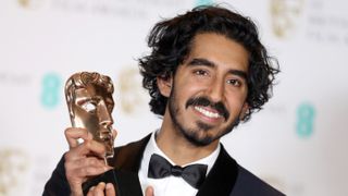 LONDON, ENGLAND - FEBRUARY 12:Supporting Actor winner Dev Patel poses with his award in the winners room during the 70th EE British Academy Film Awards (BAFTA) at Royal Albert Hall on Februar