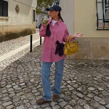 Influencer Rebecca Ferraz Wyatt wearing straight-leg jeans. 